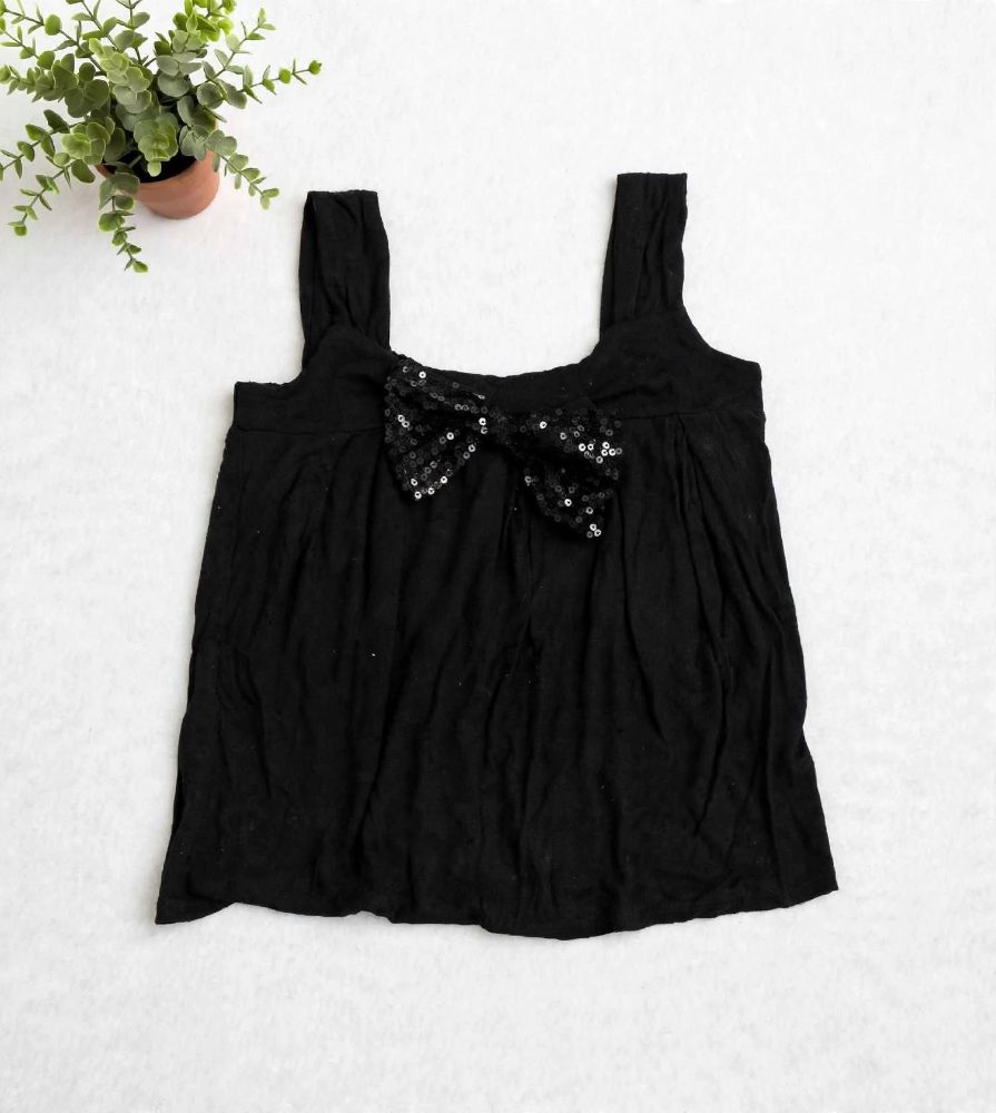 H&M Top H&M noir avec nœud à sequins 10 ans bon état